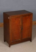 20th century mahogany shoe cupboard, the pair of doors enclosing two pairs of metals rails, 61.5cm