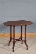 Late Victorian centre table, the chamfered top above four fluted legs and shaped feet with brass