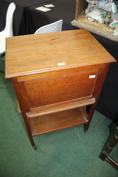 20th century oak sewing trolley, with drop front sides and bakelite drop handled, with under tier