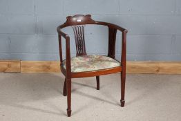 Edwardian mahogany tub chair, having shaped back rail, pierced slat backs and floral upholstery,