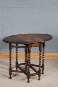 20th century oak dropleaf table, the oval top raised on barley twist gateleg supports, 92cm wide