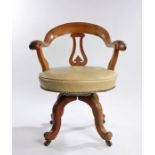 Victorian mahogany desk chair, the arched back above a shaped splat and stuff over seat above curved