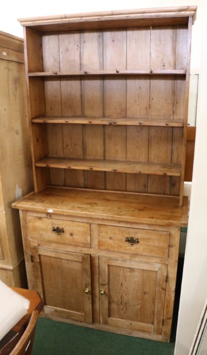 Late 19th/ early 20th century stripped pine dresser, the plate rack with three shelves and hanging