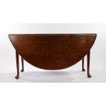 George III mahogany drop leaf dining table, the D shaped leaves, raised on tapering turned legs