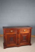 Late Victorian mahogany sideboard, fitted two drawers above a pair of doors with arts and crafts