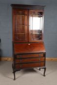 Early 20th century mahogany bureau bookcase, the moulded top above a pair of astragal glazed doors