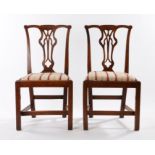 Pair of George III oak chairs, with an undulating top rail above the shaped splat and drop in seat