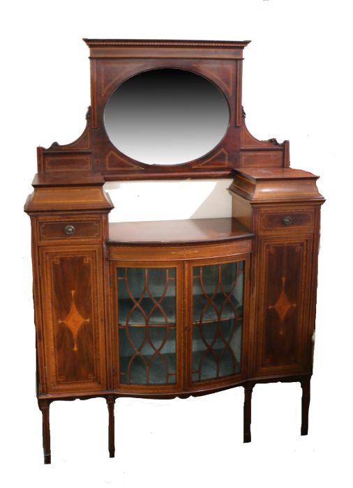 Edwardian mahogany and boxwood inlaid display cabinet, having oval mirror above a bowfront