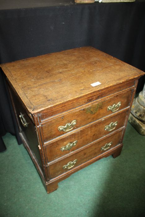 18th century oak converted log/coal bin, in the form of a chest of drawers, the hinged lid with