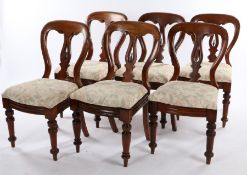 Set of six Victorian mahogany dining chairs, the curved cresting rails above pierced splat backs,
