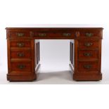 Victorian mahogany kneehole desk, the rectangular top with inset leather above nine drawers to the