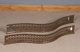 Pair of 19th Century wrought iron fenders of serpentine form, with pierced decoration, 122cm long (