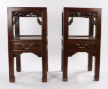 Pair of Chinese hardwood tables, the square dished tops above an open recess and central drawer with