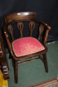 Oak tub chair with inlaid supports