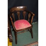 Oak tub chair with inlaid supports