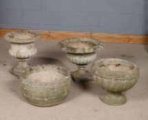 Four various reconstituted stone garden planters, one in the form of an urn, another with bark