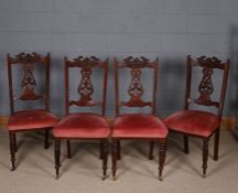 Set of four late Victorian mahogany dining chairs, each with carved pierced splats, raised on ring