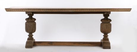 Early 20th Century oak refectory table, in the Elizabethan taste, the long rectangular top above two