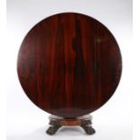 William IV rosewood breakfast table, the circular tilt top raised on a gadrooned tapering stem,