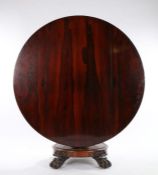 William IV rosewood breakfast table, the circular tilt top raised on a gadrooned tapering stem,