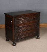 17th century style oak chest of drawers, having three linen fold long drawers, raised on bun feet,