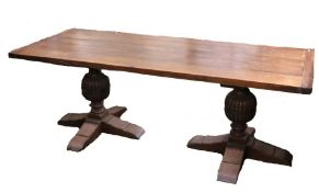 Jacobean style oak refectory table, the rectangular planked top raised on two pedestals with bulbous
