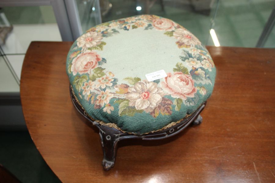 Victorian carved mahogany and floral upholstered foot stool, raised on scroll feet (one leg AF),