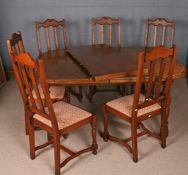 20th century oak veneered extending dining table, with one extra leaf, 150cm wide, together with a