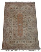 Turkish Khula carpet, the cream ground with scroll and foliate decoration, with tasselled ends,