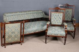 Edwardian rosewood inlaid salon suite, comprising settee, pair of open armchairs, and fire screen,