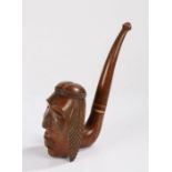 Large carved wooden novelty pipe, the bowl modelled as a native American wearing a feather
