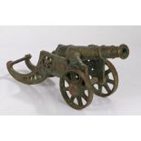 Brass model cannon on a roundel pierced stand, 46cm long