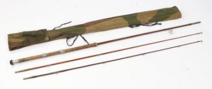 Cork handled spinning rod, with two top sections, housed in a camouflage slip case, the rod 228cm