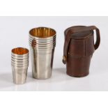 Set of six silver plated hunting tot cups and wine cups, of tapering form with gilt interiors,