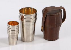 Set of six silver plated hunting tot cups and wine cups, of tapering form with gilt interiors,