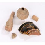 Archaeological finds to include terracotta flask and bottle, bird's head, figure's head, slipware