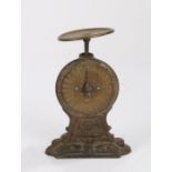 Salter's letter balance scales, the brass pan and dial on a cast iron frame, 12.5cm wide, 19cm high