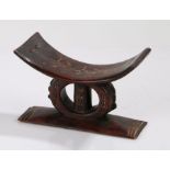 Ethiopia Oromo headrest, with dot and cross design to the arched rest above the squat circular