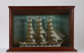 Model of a three masted ship in full sail, housed in a glazed mahogany case, 56.5cm wide, 37cm high,