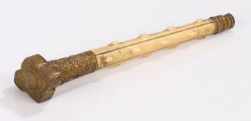 19th Century ivory and brass parasol or cane handle, the foliate decorated pommel and tapering lower