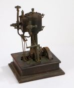 19th Century stationary steam engine, with coopered boiler above the cast frame and fly wheel,