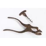 Mid 19th Century steel lever corkscrew, the handle with central cast section bearing a crest above