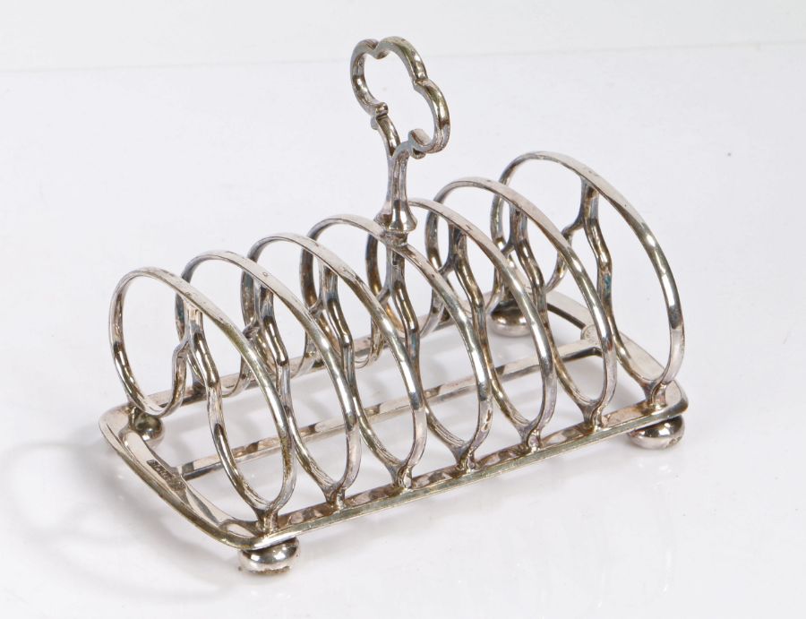 SS Great Britain interest- Silver plated six division toast rack, the pierced quatrefoil handle