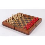 Late Victorian mahogany cased travelling miniature Chess Set, of folding rectangular form, the