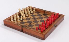 Late Victorian mahogany cased travelling miniature Chess Set, of folding rectangular form, the