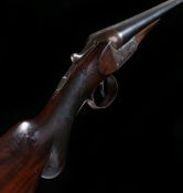 Charles Boswell 12 bore side by side shotgun, the walnut stock with attached rubber recoil pad,