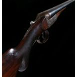 Charles Boswell 12 bore side by side shotgun, the walnut stock with attached rubber recoil pad,