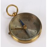 Early 20th Century brass pocket travelling compass, with silvered dial, 4.5cm diameter, 6.5cm high