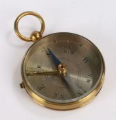 Early 20th Century brass pocket travelling compass, with silvered dial, 4.5cm diameter, 6.5cm high