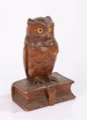 Black Forest style inkwell, modelled as an owl perched on a book, the hinged lid opening to reveal a